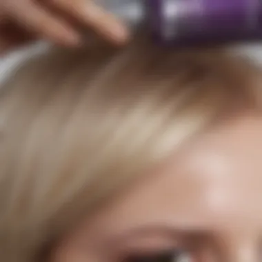 Close-up of blonde hair being treated with purple shampoo