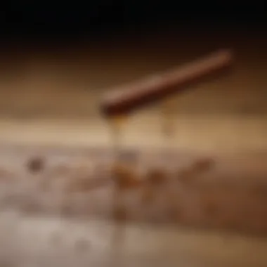 Cinnamon Oil Showcase Close-up of cinnamon oil droplets on a wooden surface