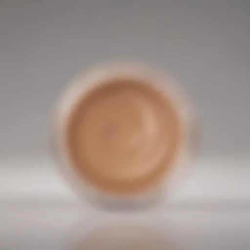 The elegant texture of a light liquid foundation swatched on a smooth surface