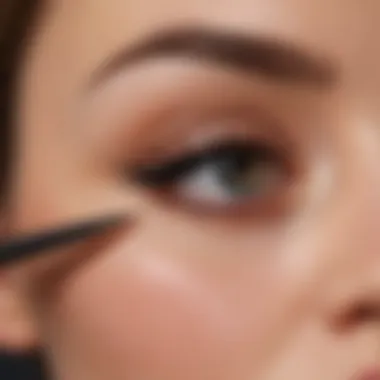 Demonstration of applying long lasting eyeliner on eyelids for a precise look.