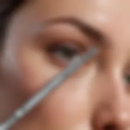 Close-up of a dermaplaning tool on a skincare surface