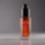 A close-up of a glossy, vibrant skin plumper serum in a dropper bottle.