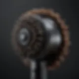 A close-up of a high-quality blowout tool designed for curly hair