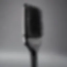 Close-up view of a vented paddle brush displaying its unique design