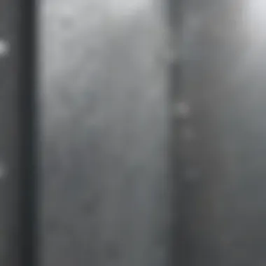 Close-up of water droplets on a fog-free shower mirror